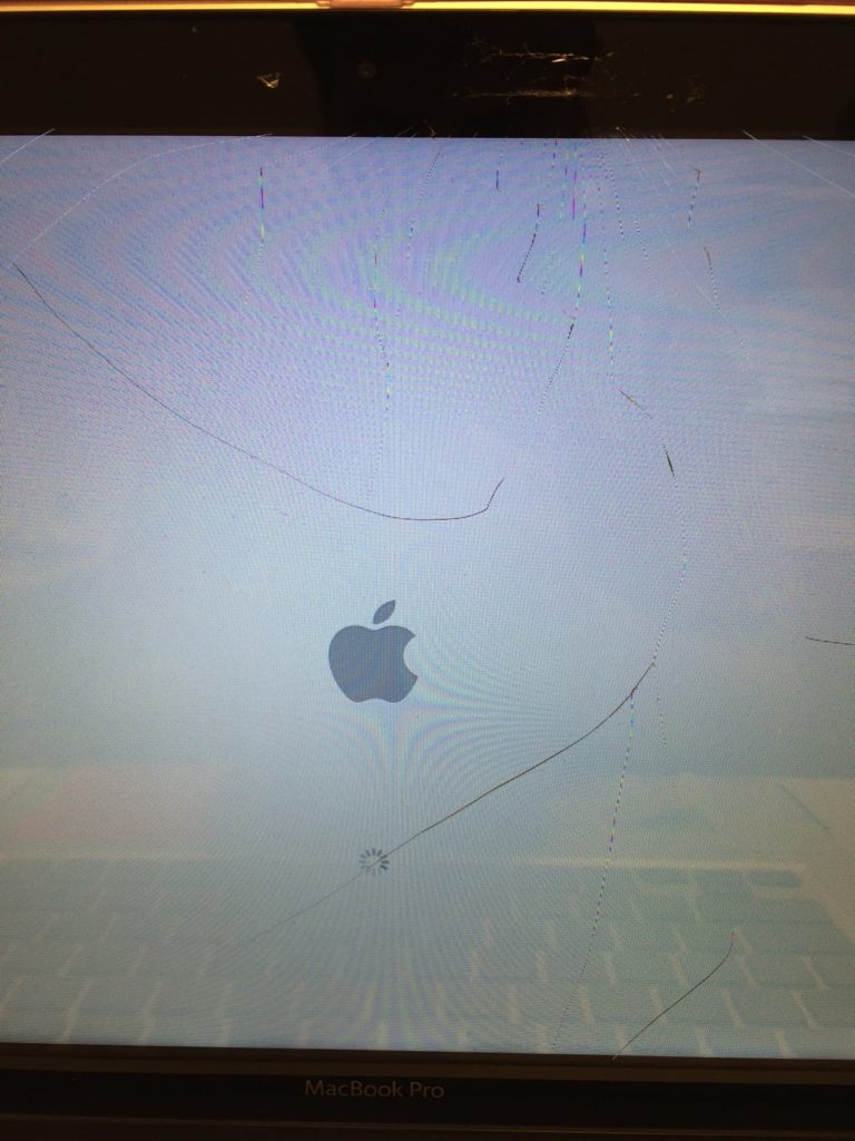 Cracked Glass Panel On MacBook Pro