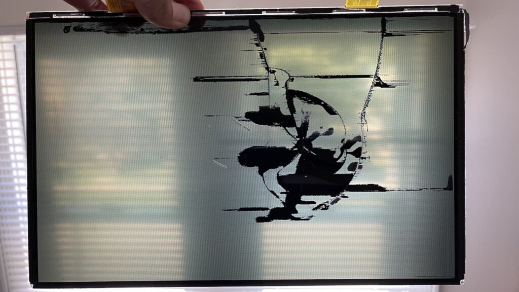 LCD panel pulled from A1466 MacBook Air with crack